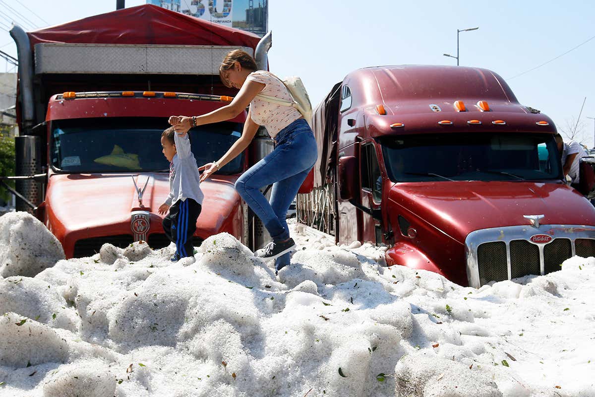 people walking over hail