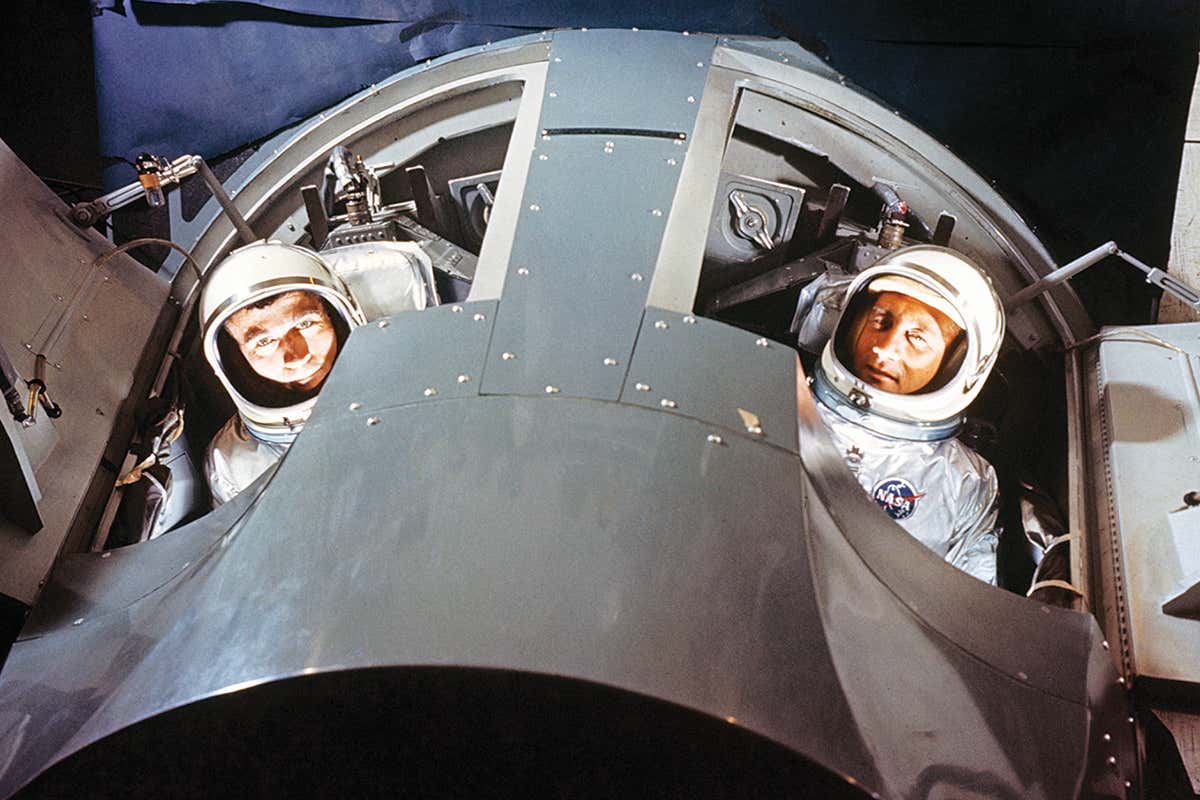 Astronauts in mock cockpit