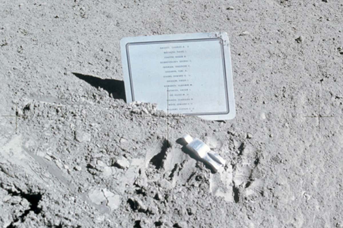 A close-up view of a commemorative plaque left on the Moon at the Hadley-Apennine landing site in memory of 14 NASA astronauts and USSR cosmonauts, now deceased.