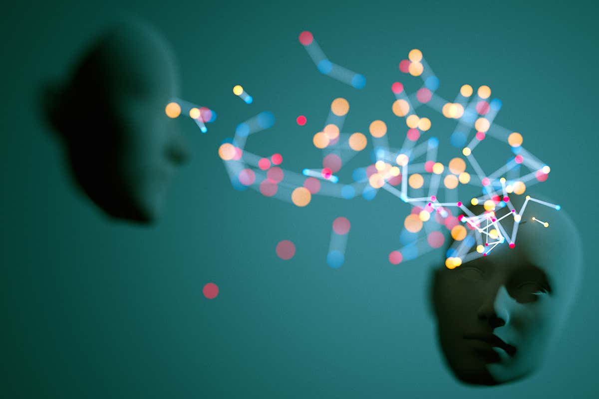 Two heads with some dots between them