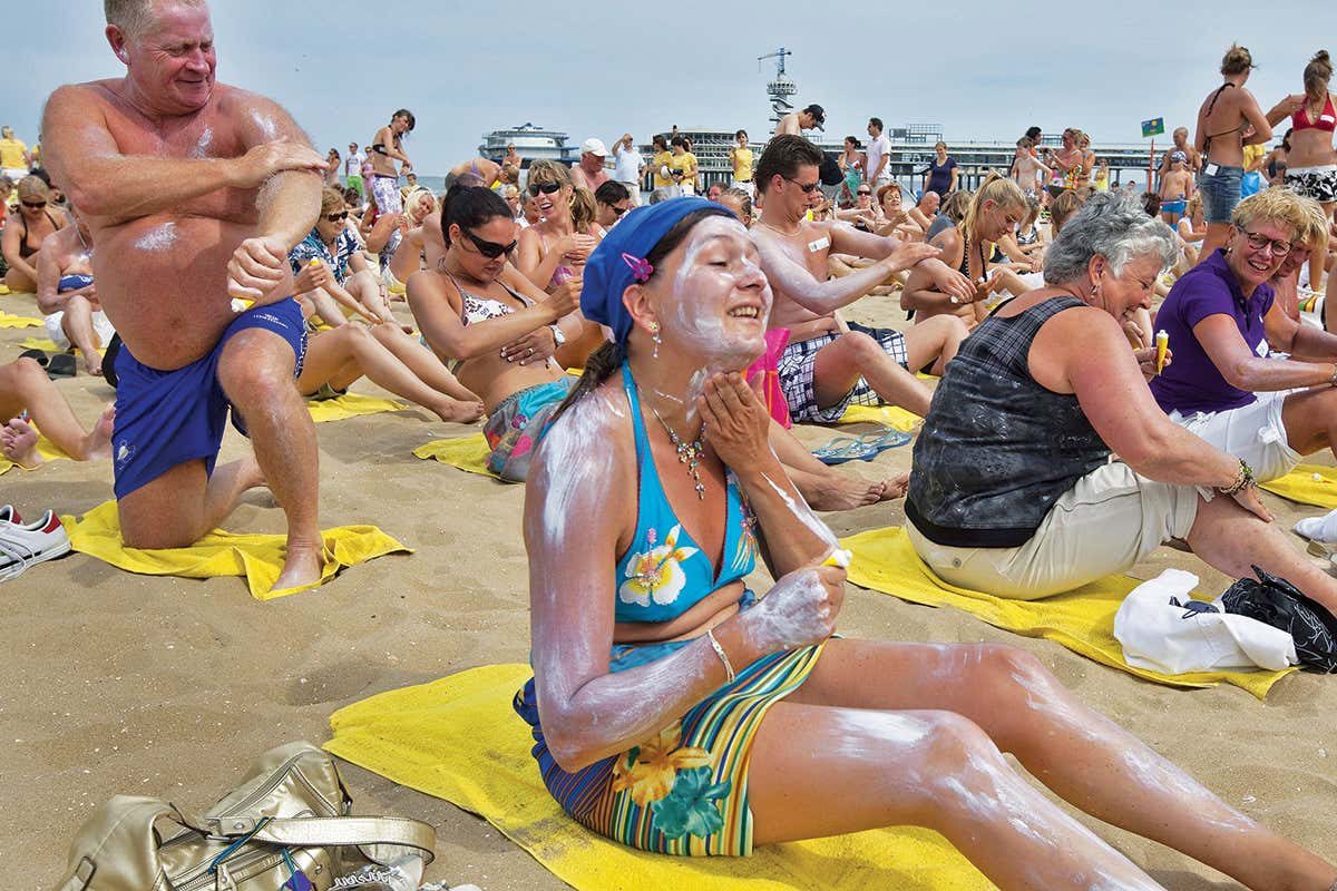 Applying sunscreen on beach