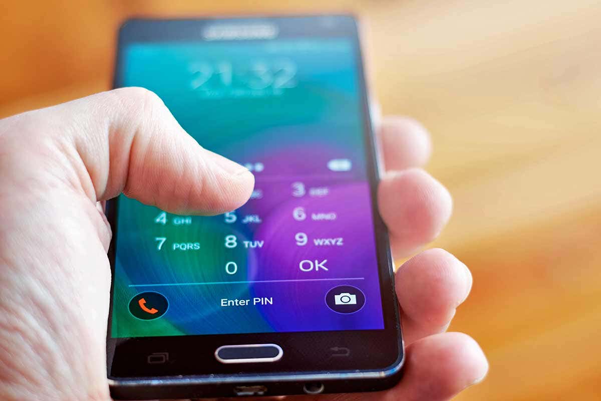 A person unlocks their phone