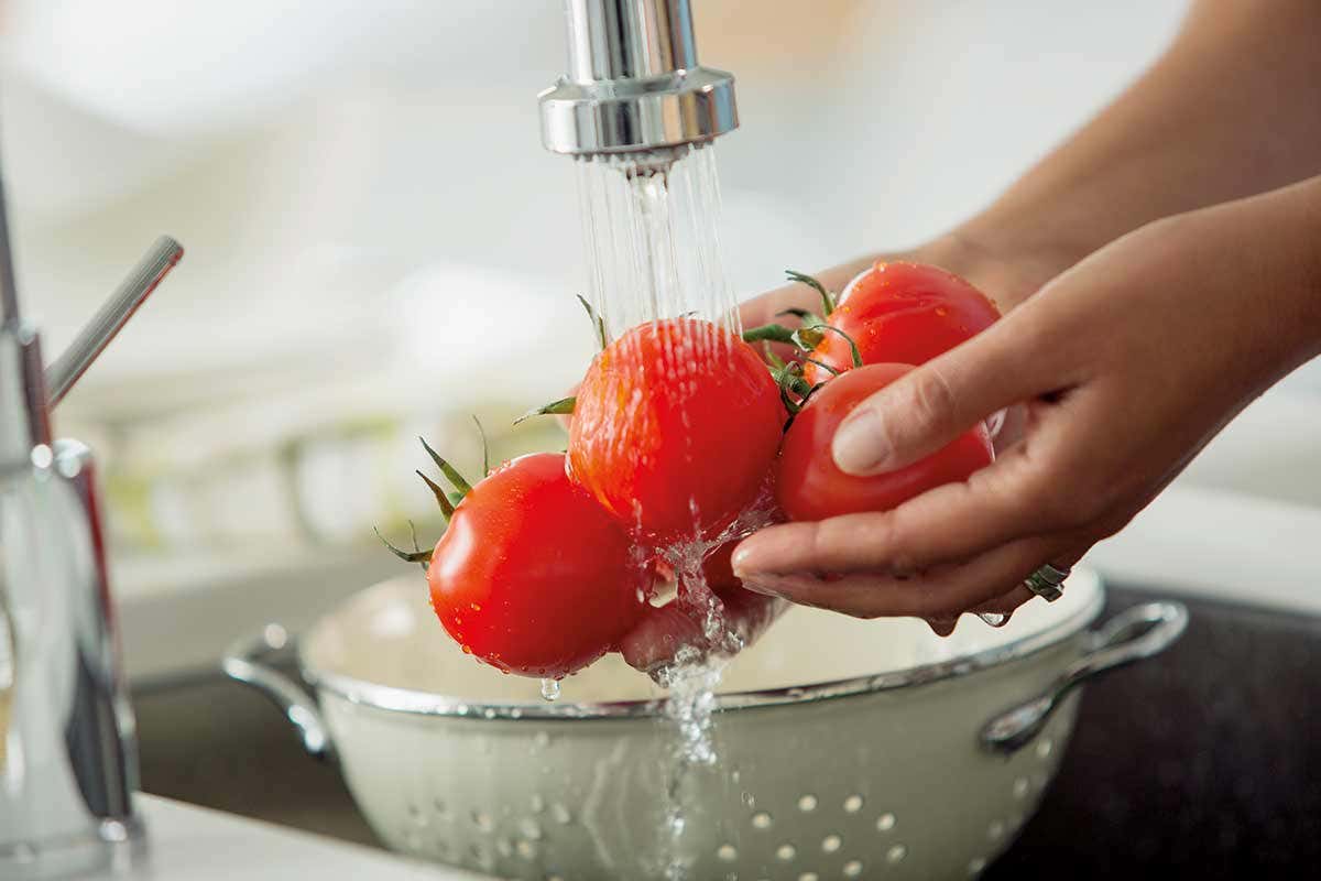 rinsing tomatoes