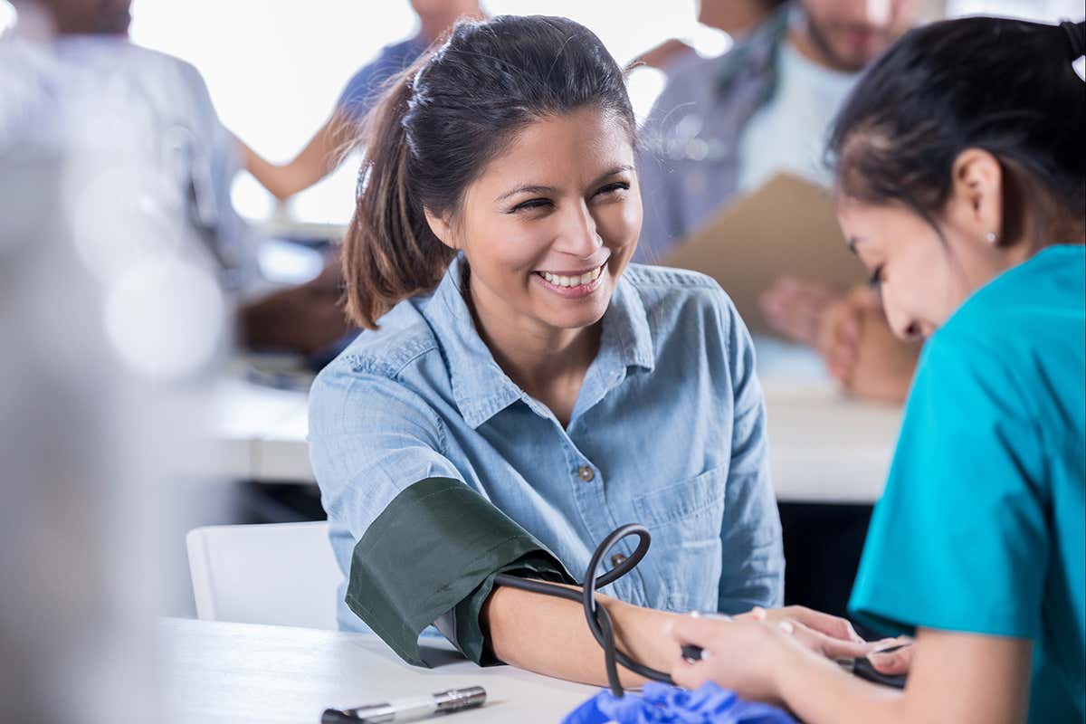 A woman has their heart rate monitored