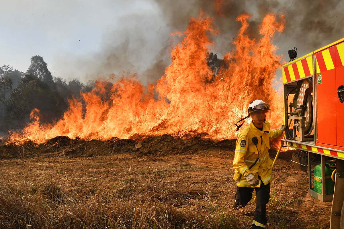 New South Wales Rural Fire Service (NSW RFS) firefighters back burning and fighting fires on Long Gully Road in the northern New South Wales town of Drake, Australia, 09 September 2019. A number of homes have been destroyed by bushfires in northern New South Wales and Queensland.