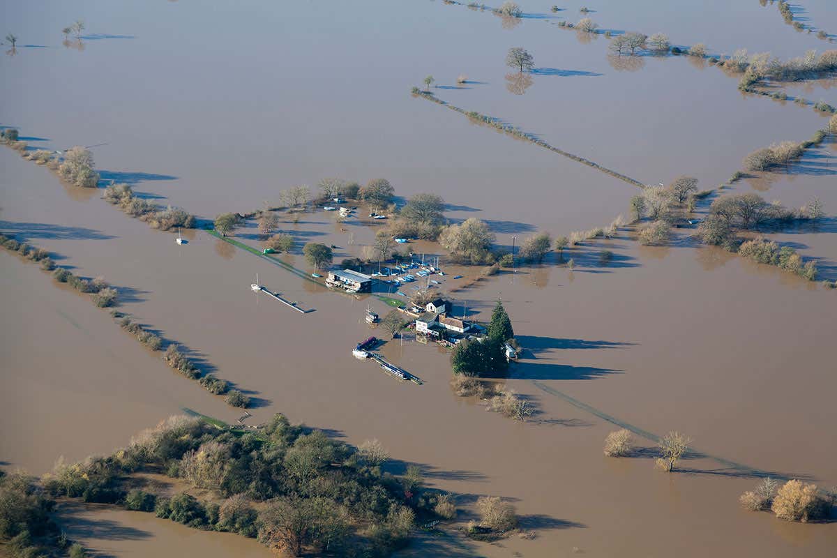 An aerial view from a light aircraft of an English pub and sailing club, surrounded by water when the River Severn burst it's banks in November 2012.