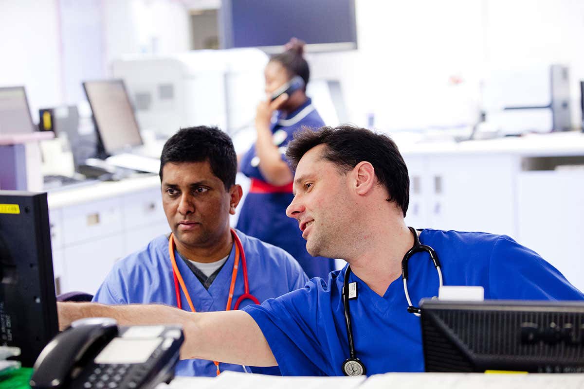 Two Accident and Emergency doctors discuss a case UK