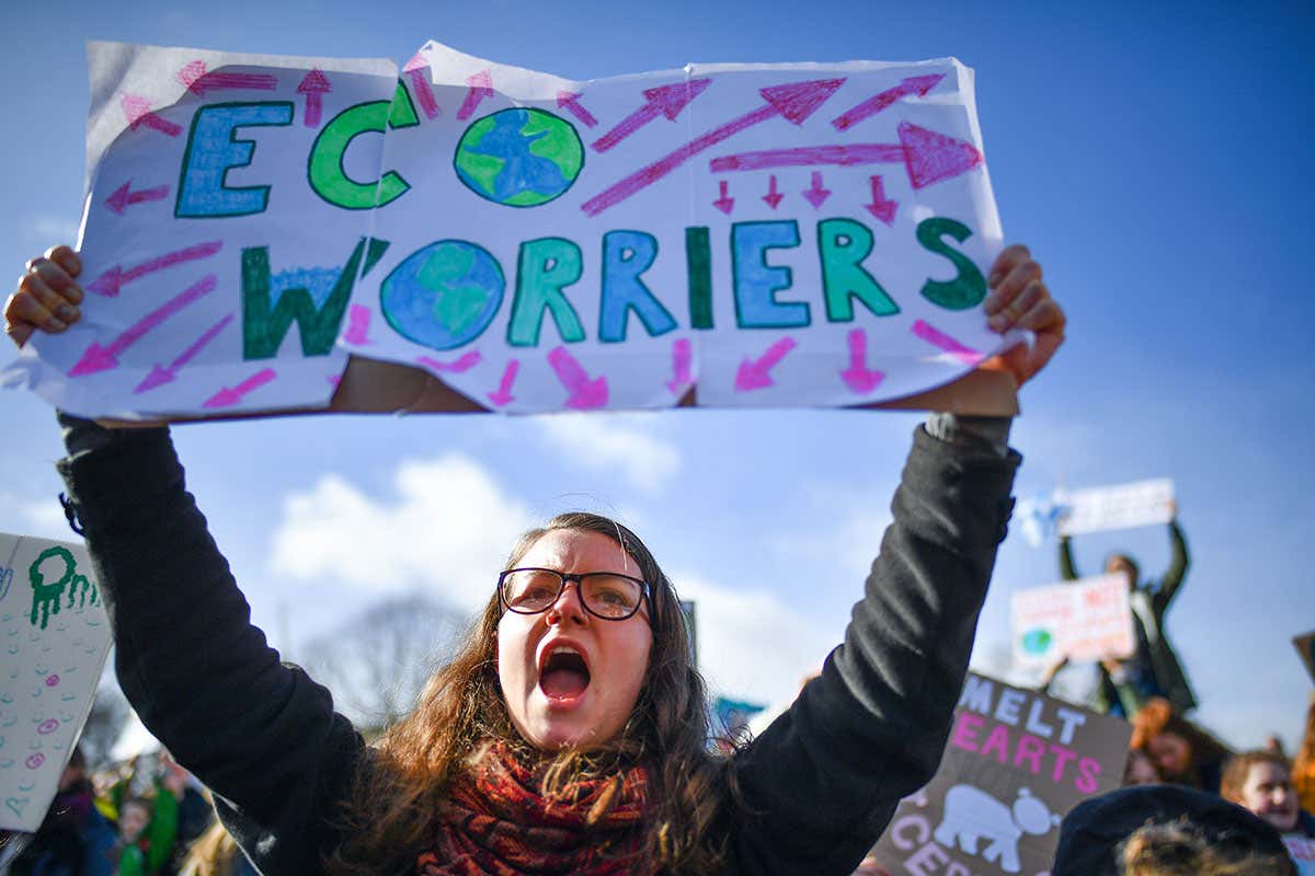 EDINBURGH, SCOTLAND - MARCH 15: School children hold placards and shout slogans as they participate in a protest outside the Scottish Parliament on March 15, 2019 in Edinburgh, Scotland. Students around the world took to the streets on March 15 to protest a lack of climate awareness and demand that elected officials take action on climate change. Inspired by Greta Thunberg, the 16-year-old environmental activist who started skipping school since August 2018 to protest outside Sweden's parliament, school and university students worldwide have followed her lead and shared her alarm and anger. (Photo by Jeff J Mitchell/Getty Images)