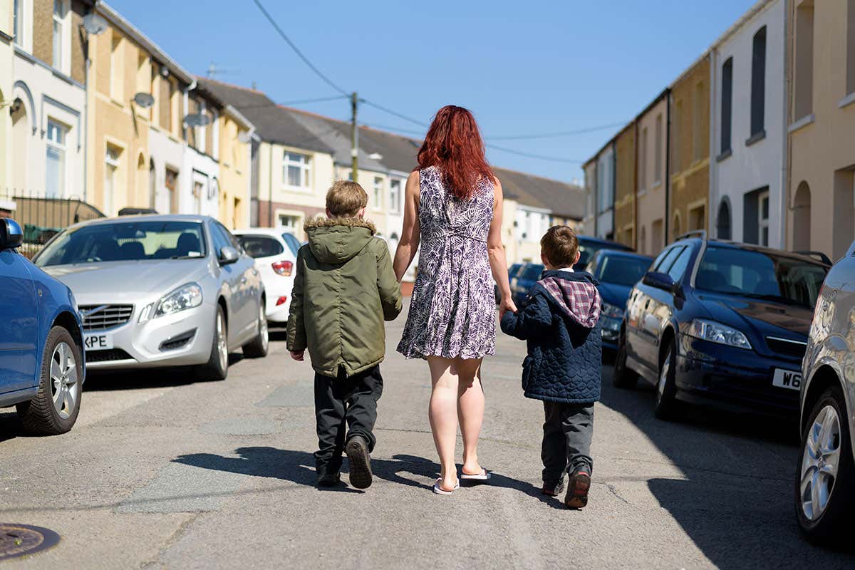 Mother walking children to school