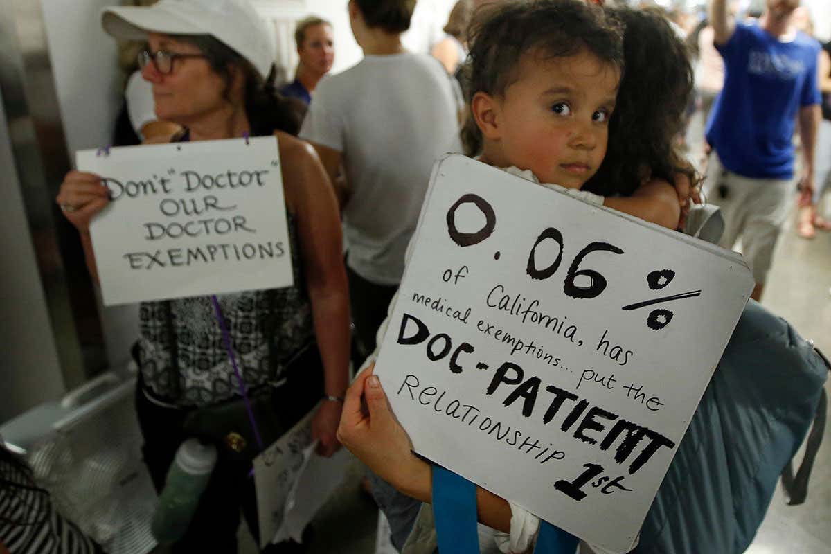 Chelsea Lydell holds her son, Joseph, 4, as she joins hundreds of others waiting to get into a legislative committee to oppose a proposal to give state public health officials instead of local doctors the power to decide which children can skip their shots before attending school, at the Capitol, in Sacramento, Calif. The bill, by state Sen. Richard Pan, D-Sacramento, a pediatrician, said his legislation would give state health officials the tools they need to prevent outbreaks of vaccine-preventable diseases like measles
