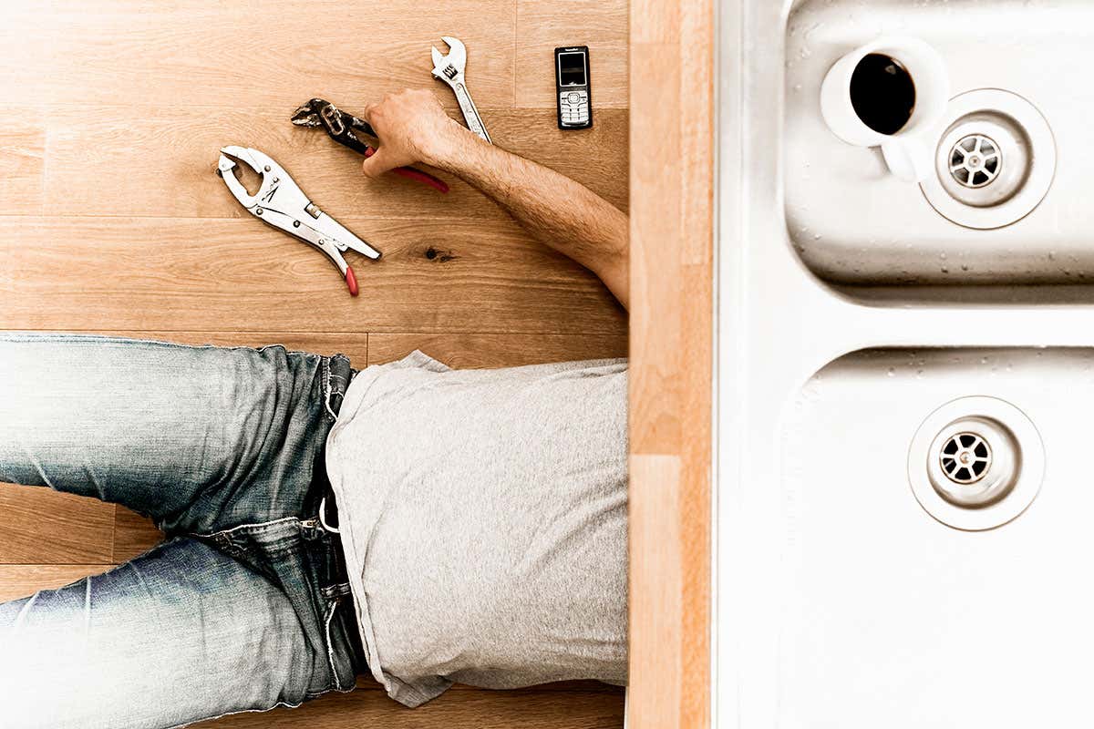Man repairing sink