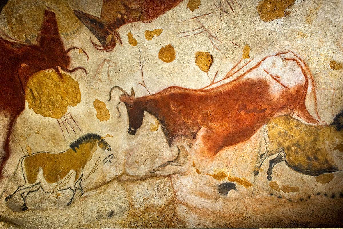 Lascaux II replica of a Lascaux cave painting. These are horse and cow figures in the central gallery. The original Lascaux cave was closed to the public in 1963. The full-scale Lascaux II replica opened nearby in 1983. The Lascaux cave paintings in south-western France, around 17,000 years old, were painted by Cro-Magnon man, an early European culture of modern humans (Homo sapiens sapiens), using red, brown and yellow ochre, and black manganese dioxide. They may have had religious and artistic significance. Photographed in 2010.