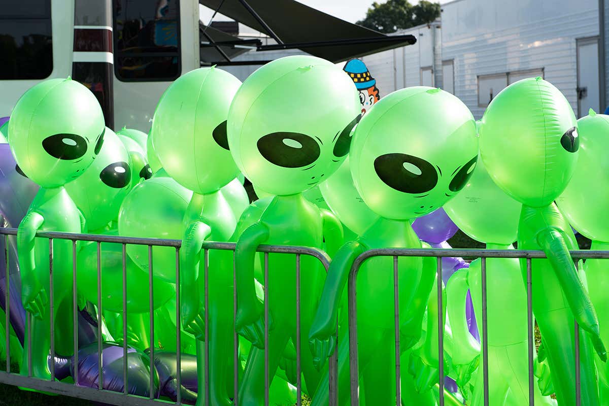 Inflatible green Aliens standing in line