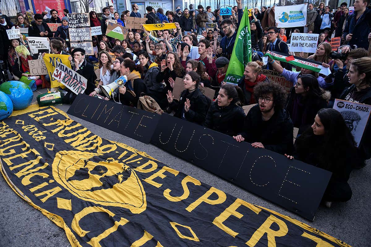 Demonstrators protest outside the UN Climate Change Conference COP25