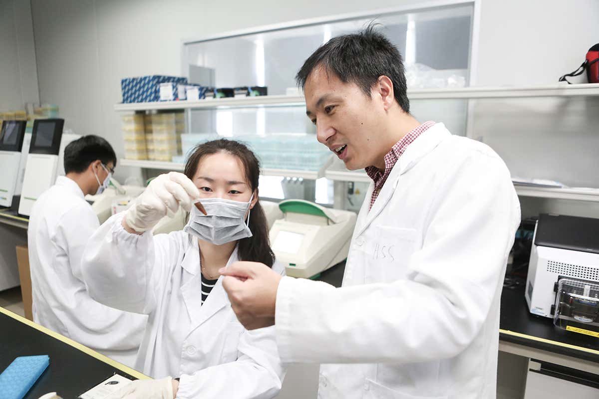 Jiankui He (right) and another researcher