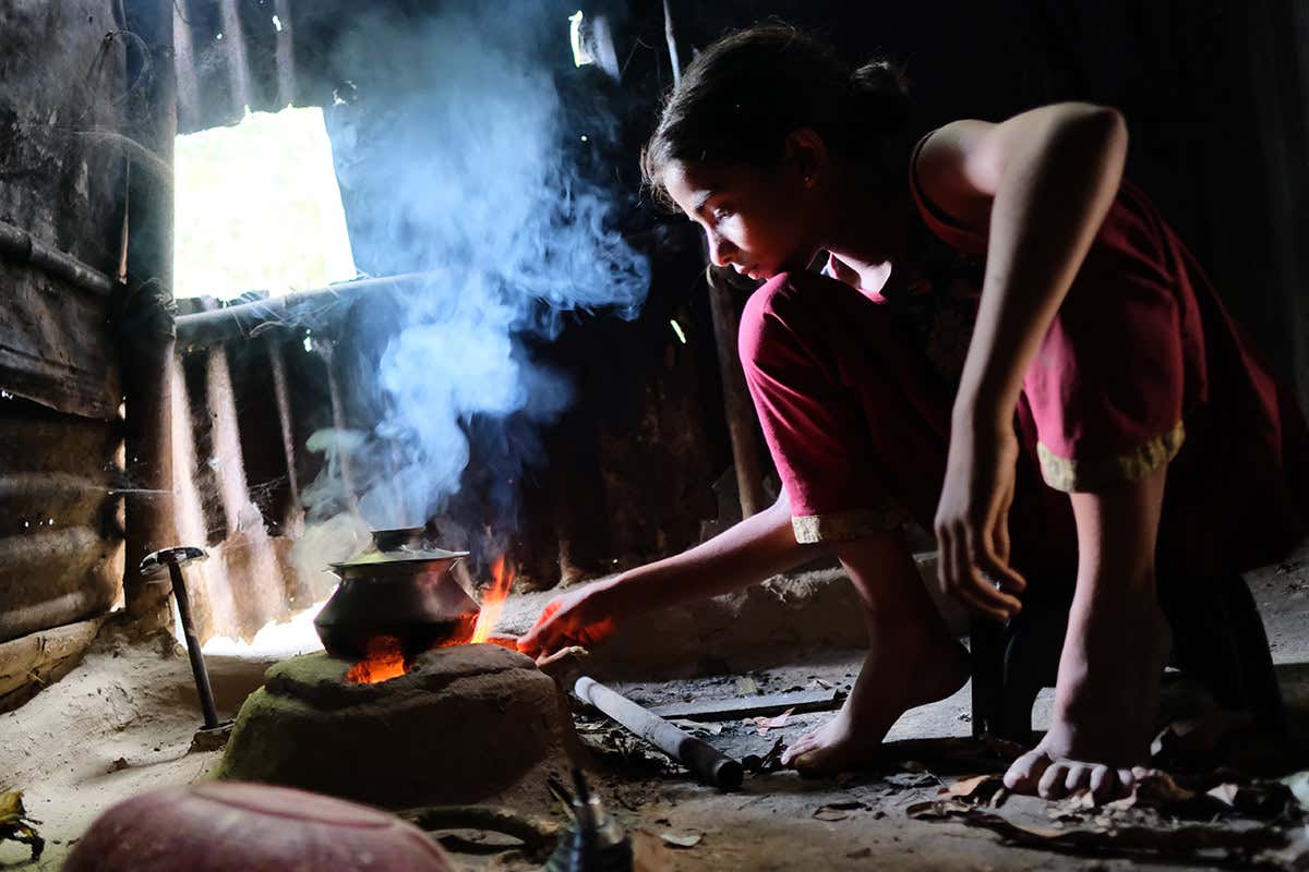 child cooking indoors
