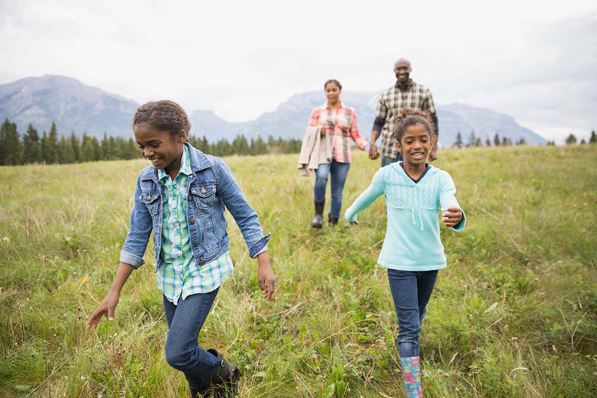 Family walking in field