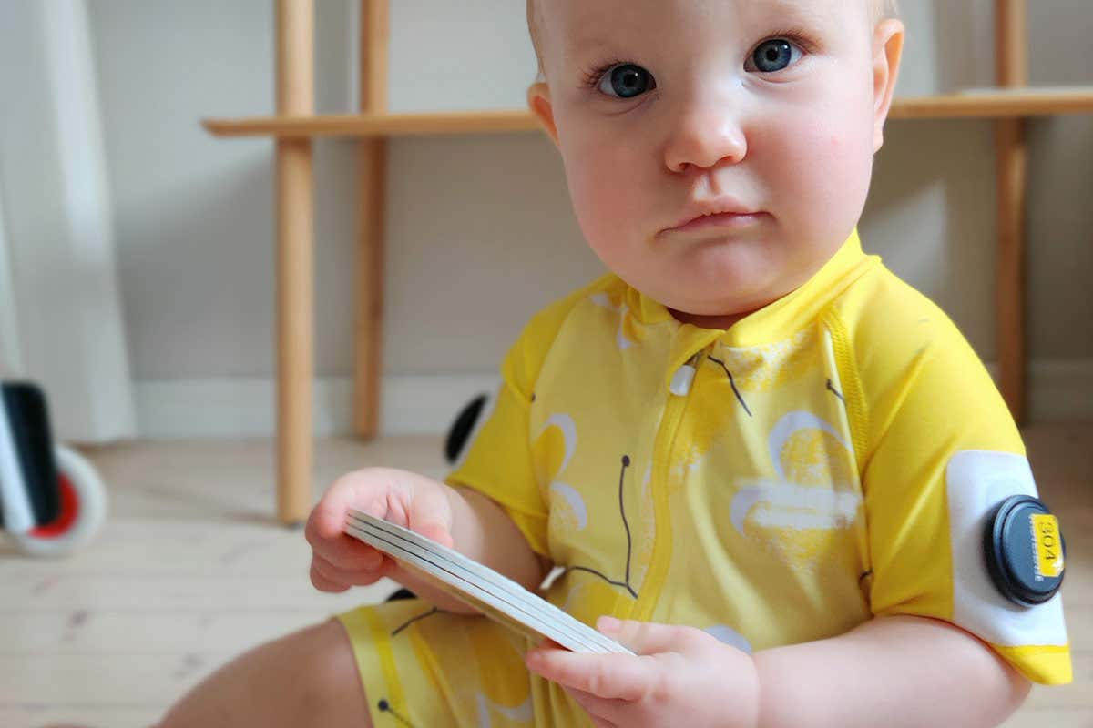 A baby wearing the smart jumpsuit