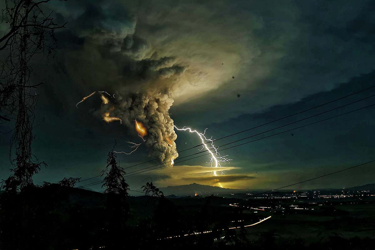 A lightning streak over Batangas as Taal Volcano continued to erupt yesterday
