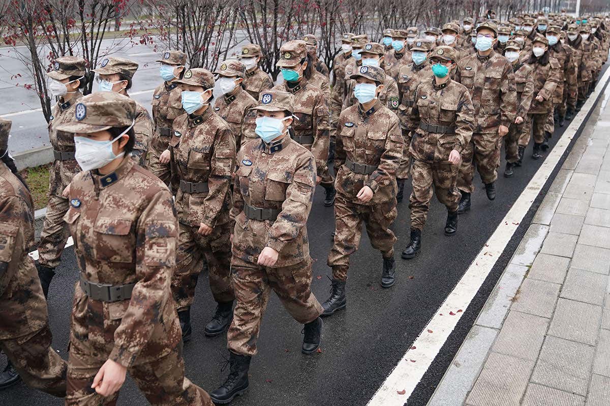 A military medical team heading to a Wuhan hospital