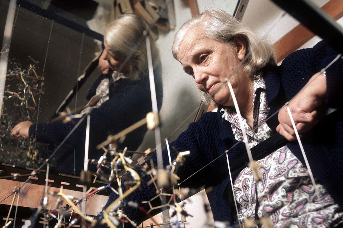 The British chemist Dorothy Hodgkin showing the model of protein molecular structure.