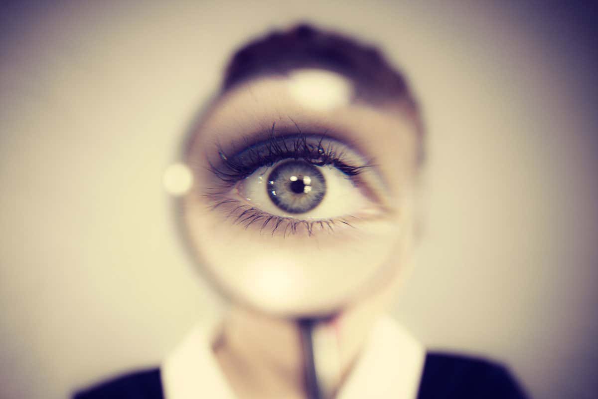 eye through magnifying glass