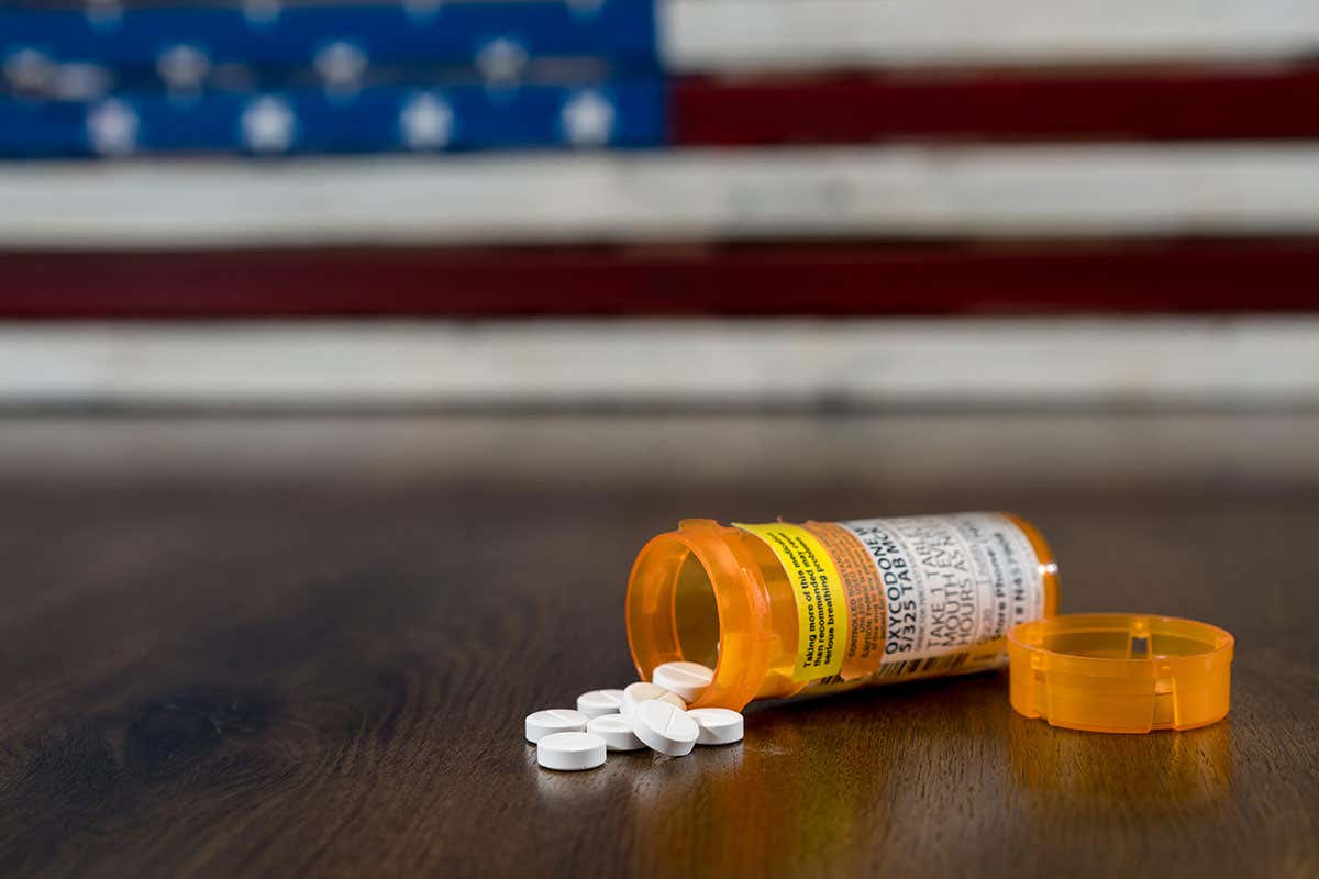 Oxycodone bottle and US flag