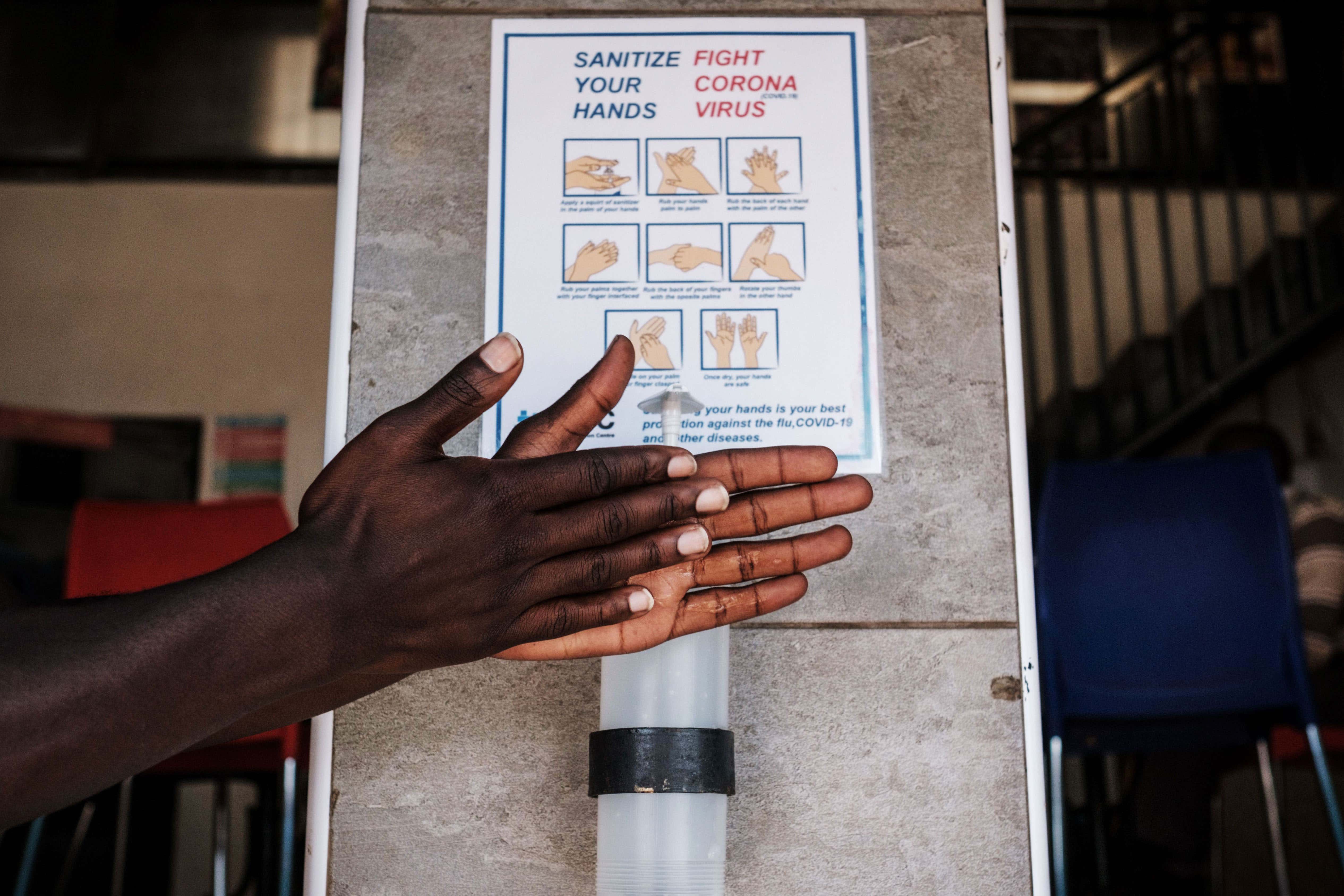 using hand sanitiser to help avoid spreading the coronavirus