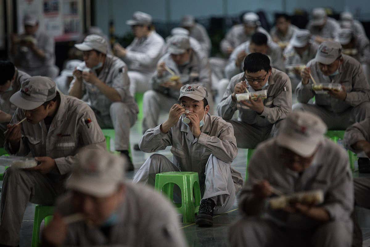 A factory worker in Wuhan eating lunch