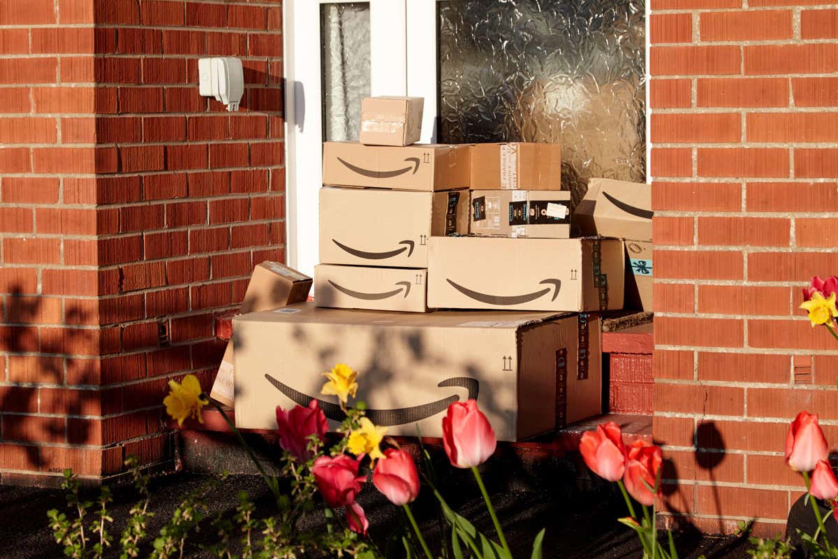 large consignment of amazon deliveries left on doorstep of house during coronavirus covid-19 lockdown in the uk