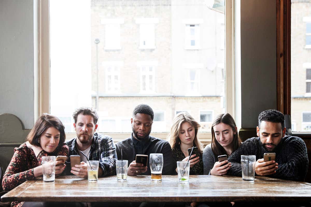 People looking at smartphones