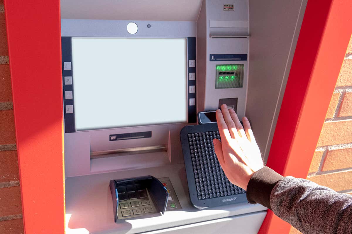 Haptic device being used at an ATM