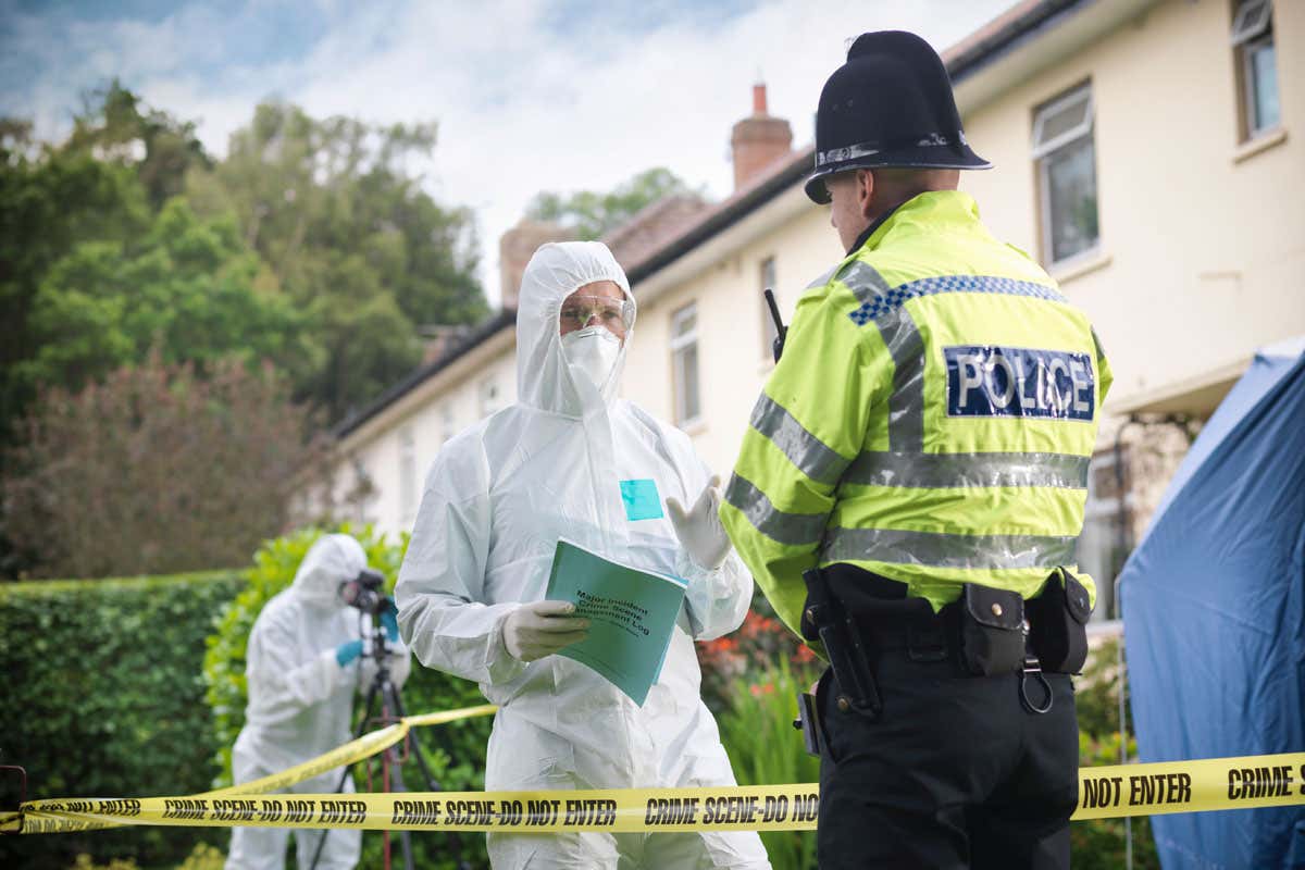 Forensic scientist and police officer