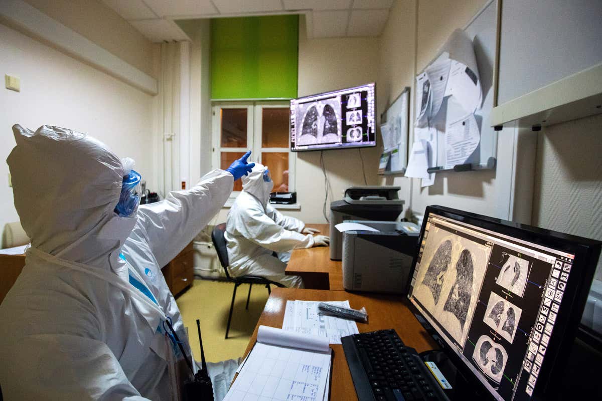 Doctors looking at lung scans