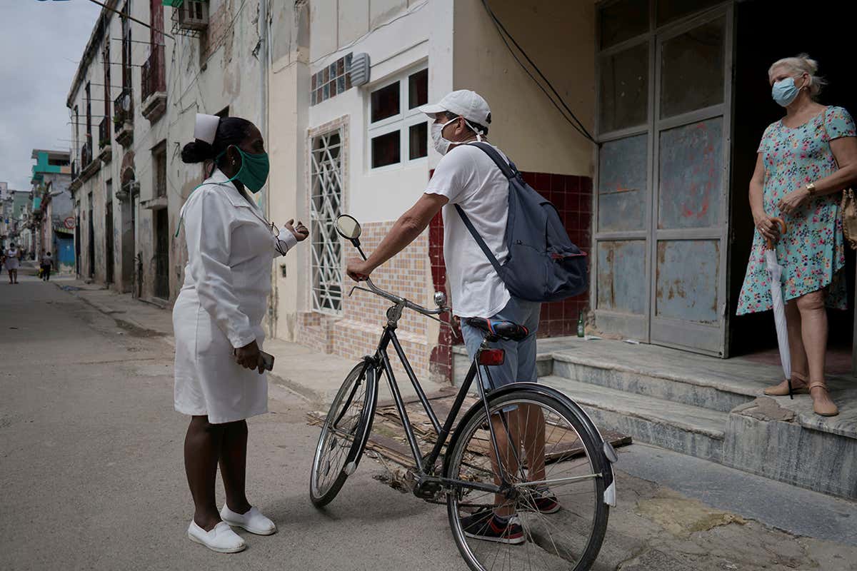 A Nurse checks door-to-door for people with symptoms of COVID-19 in Havana, Cuba