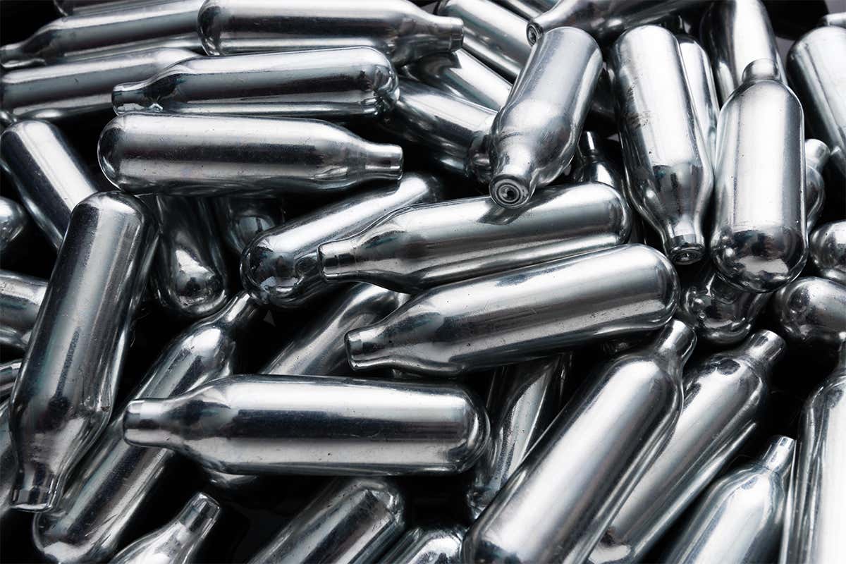 A pile of nitrous oxide canisters