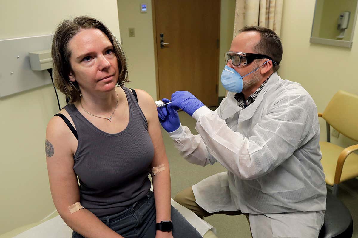 A volunteer in Seattle takes part in a trial for a vaccine developed by Moderna