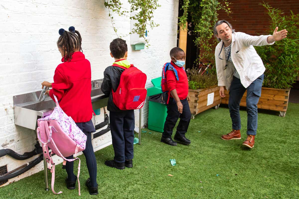 Pupils wash their hands