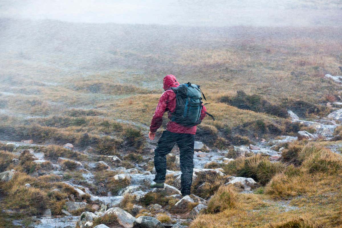 person walking on hillside