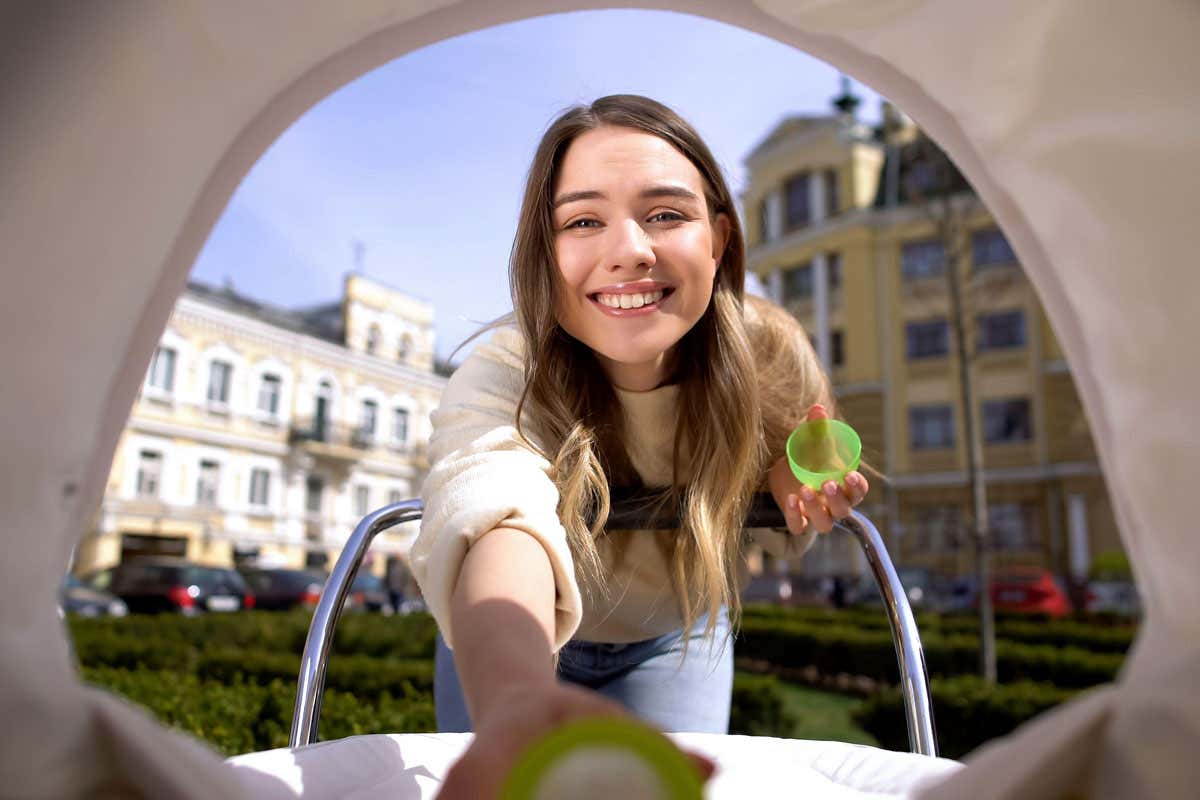 woman holding baby bottle