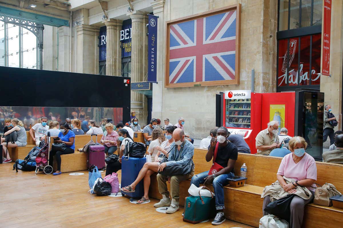 People sitting and waiting in a train station