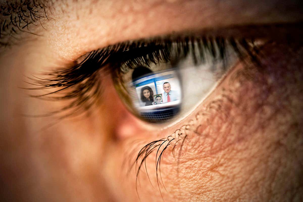 Reflection of video conference on computer in eye