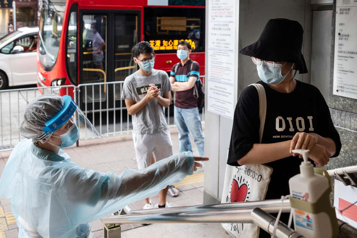 Person waits in line to receive covid-19 test kit