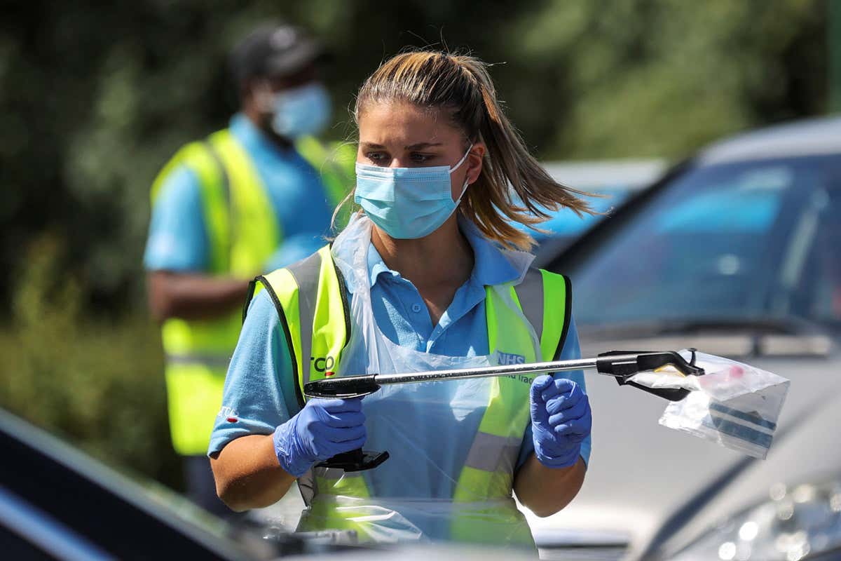 Woman holding testing sample