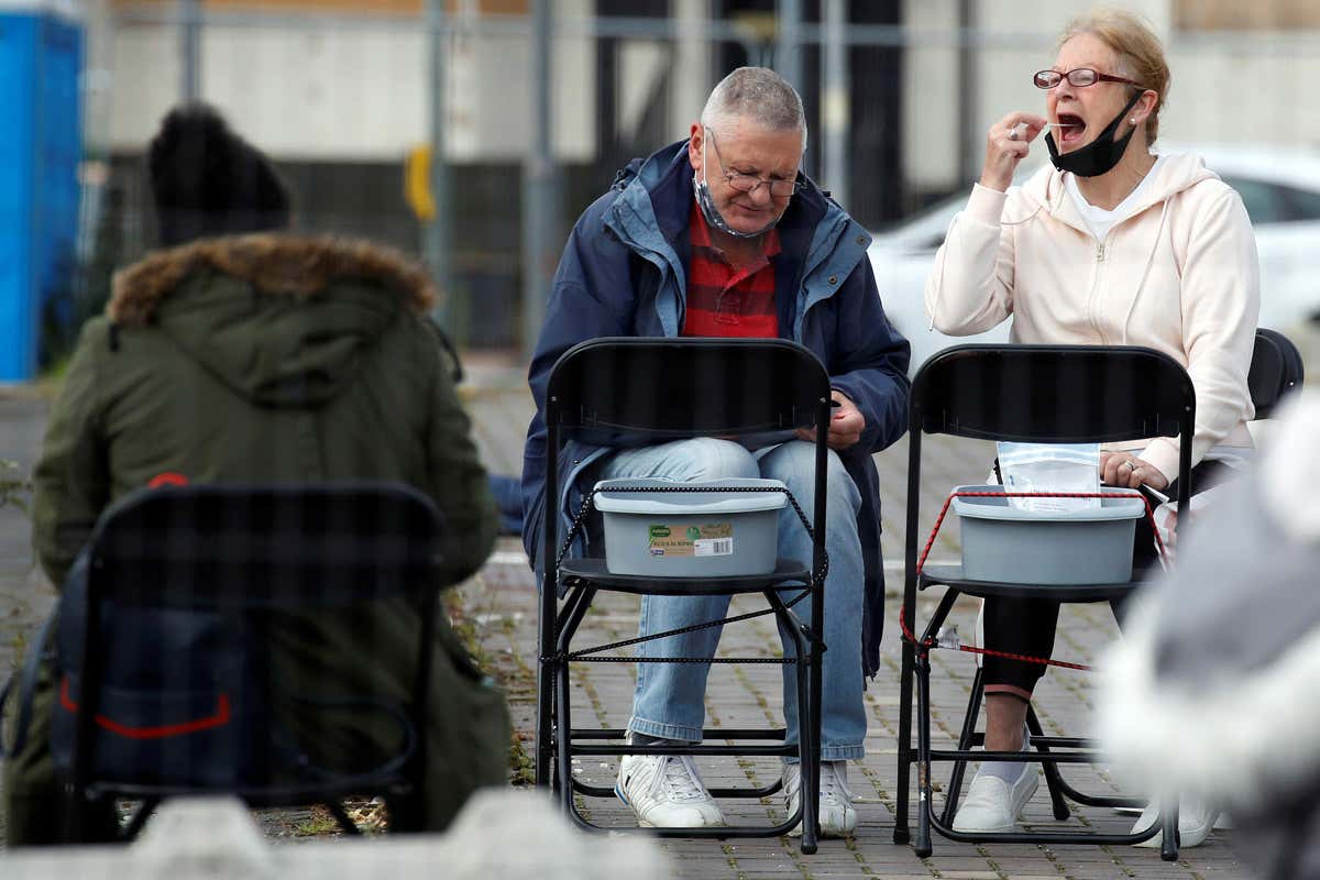 People take coronavirus swab tests