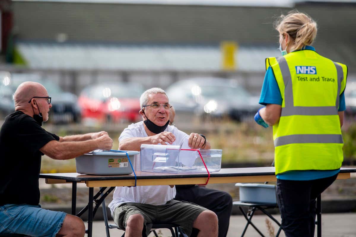 Two people attend a covid-19 testing facility