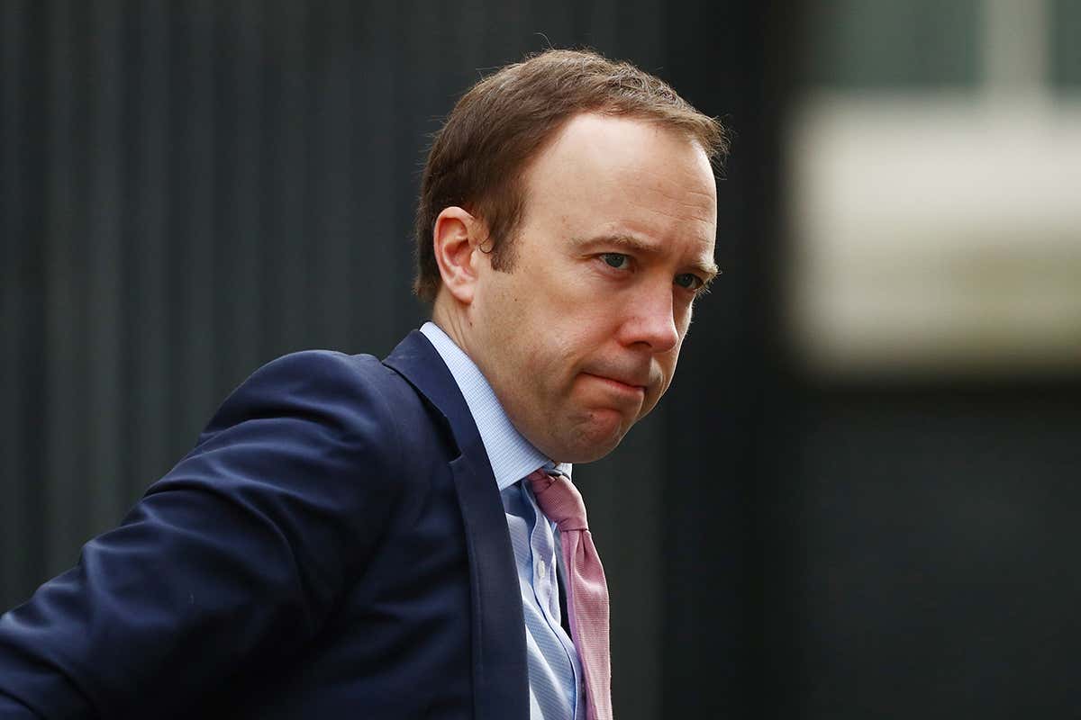 UK health minister Matt Hancock pursing his lips