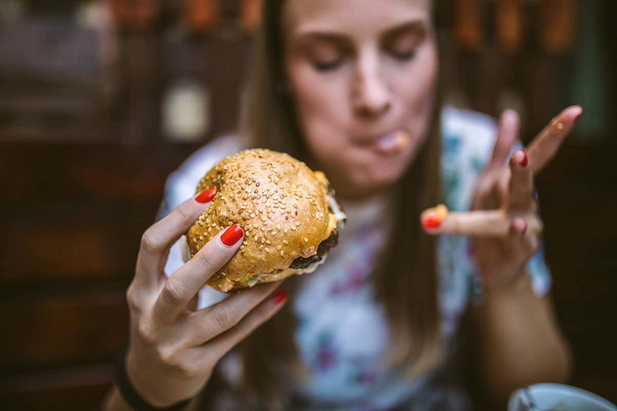 Woman eating a burger