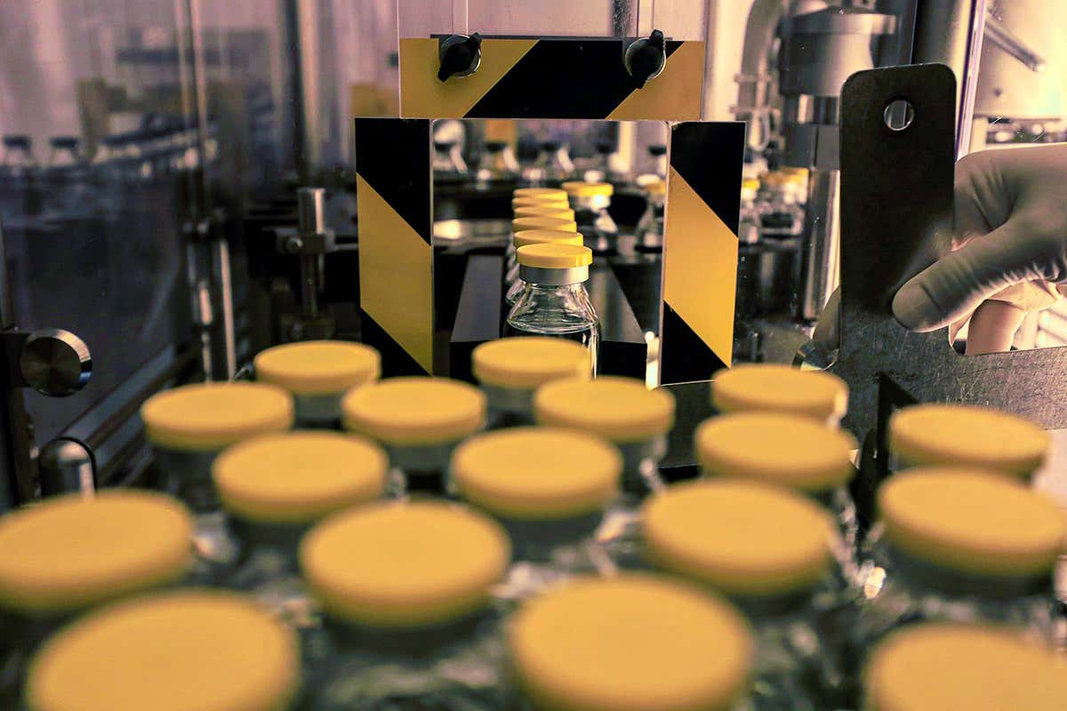 A lab technician works on investigational covid-19 drug remdesivir at Eva Pharma Facility in Egypt in June