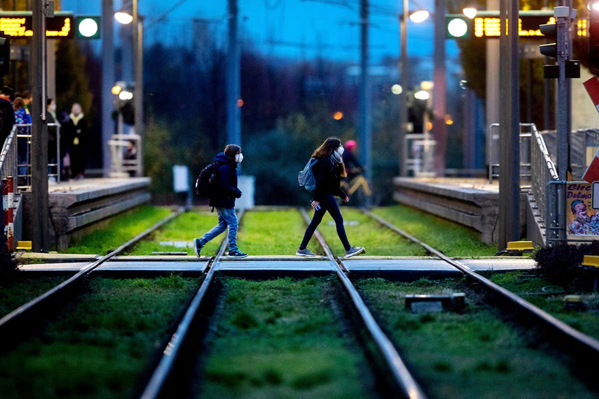people crossing rail line